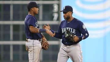 Sep 26, 2016; Houston, TX, USA; Seattle Mariners shortstop Ketel Marte (4) celebrates with second baseman Robinson Cano (22) after the Mariners defeated the Houston Astros 4-3 in eleven innings at Minute Maid Park. Mandatory Credit: Troy Taormina-USA TODAY Sports