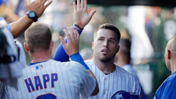 CHICAGO, IL - JULY 19: Victor Caratini #7 of the Chicago Cubs is congratulated in the dugout after scoring against the St. Louis Cardinals on an RBI double hit by Anthony Rizzo #44 (not pictured) during the fifth inningat Wrigley Field on July 19, 2018 in Chicago, Illinois. The Chicago Cubs won 9-6. (Photo by Jon Durr/Getty Images)