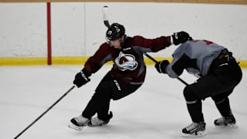 CENTENNIAL, CO - SEPTEMBER 23: Gabriel Bourque (57) of the Colorado Avalanche collects a loose puck as he avoids John Mitchell (7) during the first day of training camp at Family Sports Ice Arena in Centennial, Colorado on September 23, 2016. (Photo by Seth McConnell/The Denver Post via Getty Images)