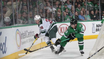 DALLAS, TX - MARCH 31: Nick Seeler #36 of the Minnesota Wild tries to keep the puck away against Tyler Pitlick #18 of the Dallas Stars at the American Airlines Center on March 31, 2018 in Dallas, Texas. (Photo by Glenn James/NHLI via Getty Images)