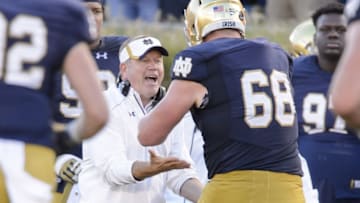 Sep 19, 2015; South Bend, IN, USA; Notre Dame Fighting Irish head coach Brian Kelly celebrates with offensive lineman Mike McGlinchey (68) after a touchdown in the fourth quarter against the Georgia Tech Yellow Jackets at Notre Dame Stadium. Notre Dame won 30-22. Mandatory Credit: Matt Cashore-USA TODAY Sports