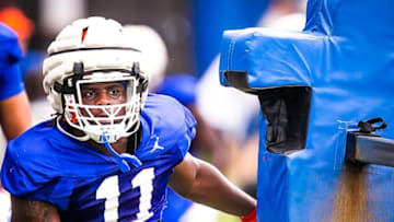 Florida Gators outside linebacker Kelby Collins (11) hits the sled during the University of Florida Football 2023 Football Spring Practice Saturday morning, March 25, 2023 at Sanders Football Practice Field at the University of Florida in Gainesville, FL. [Doug Engle/Ocala Star Banner]2023Gai Ufsrpingpractice325