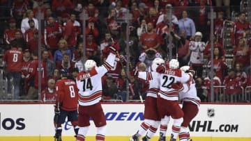 WASHINGTON, DC - APRIL 24: Brock McGinn #23 of the Carolina Hurricanes celebrates with his teammates after scoring the game winning goal in the second overtime period against the Washington Capitals in Game Seven of the Eastern Conference First Round during the 2019 NHL Stanley Cup Playoffs at Capital One Arena on April 24, 2019 in Washington, DC. The Hurricanes defeated the Capitals 4-3 in the second overtime period to move on to Round Two of the Stanley Cup playoffs. (Photo by Patrick McDermott/NHLI via Getty Images)