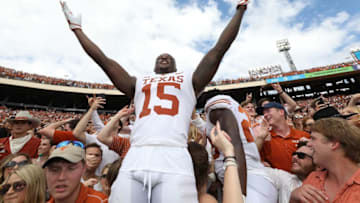 DALLAS, TX - OCTOBER 06: Chris Brown #15 of the Texas Longhorns celebrates a win against Oklahoma Sooners in the 2018 AT&T Red River Showdown at Cotton Bowl on October 6, 2018 in Dallas, Texas. (Photo by Ronald Martinez/Getty Images)