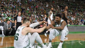 BOSTON, MA - MAY 23: Aron Baynes #46 is assisted off the floor by teammate Marcus Smart #36 of the Boston Celtics during Game Five of the Eastern Conference Finals of the 2018 NBA Playoffs against the Cleveland Cavaliers on May 23, 2018 at the TD Garden in Boston, Massachusetts. NOTE TO USER: User expressly acknowledges and agrees that, by downloading and or using this photograph, User is consenting to the terms and conditions of the Getty Images License Agreement. Mandatory Copyright Notice: Copyright 2018 NBAE (Photo by Brian Babineau/NBAE via Getty Images)