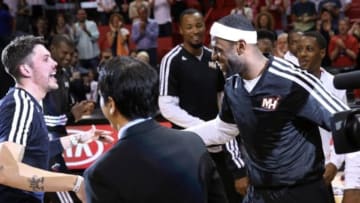 Mar 21, 2014; Miami, FL, USA; Memphis Grizzlies forward Mike Miller (left) is greeted by former teammate Miami Heat forward LeBron James (right) and head coach Erik Spoelstra before a game at American Airlines Arena. Mandatory Credit: Robert Mayer-USA TODAY Sports