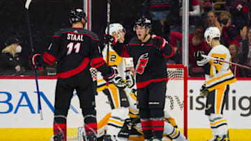 Mar 4, 2022; Raleigh, North Carolina, USA; Carolina Hurricanes center Jordan Staal (11) is congratulated by right wing Jesper Fast (71) after his goal against the Pittsburgh Penguins during the second period at PNC Arena. Mandatory Credit: James Guillory-USA TODAY Sports