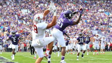 Sep 5, 2015; Evanston, IL, USA; Northwestern Wildcats safety Kyle Queiro (21) intercepts a pass intended for Stanford Cardinal tight end Austin Hooper (18) during the second half of the game at Ryan Field. Mandatory Credit: Caylor Arnold-USA TODAY Sports