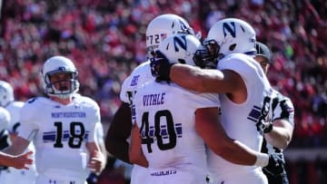 Oct 24, 2015; Lincoln, NE, USA; Northwestern Wildcats teammates celebrate with Northwestern Wildcats fullback Dan Vitale (40) after a fourth quarter touchdown at Memorial Stadium. Northwestern defeated Nebraska 30-28. Mandatory Credit: Steven Branscombe-USA TODAY Sports