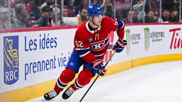 Oct 24, 2023; Montreal, Quebec, CAN; Montreal Canadiens defenseman Justin Barron (52) plays the puck against the New Jersey Devils during the first period at Bell Centre. Mandatory Credit: David Kirouac-USA TODAY Sports