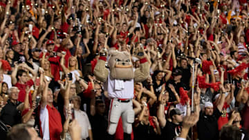 KNOXVILLE, TN - OCTOBER 05: Georgia fans and Hairy Dawg hold up a light at the end of the third quarter during a game between University of Georgia Bulldogs and University of Tennessee Volunteers at Neyland Stadium on October 5, 2019 in Knoxville, Tennessee. (Photo by Steve Limentani/ISI Photos/Getty Images).
