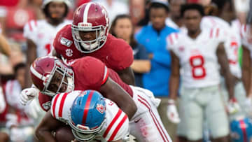Alabama defensive backs Jordan Battle (9) and Jared Mayden (21) stop Ole Miss quarterback Grant Tisdale (14) at Bryant-Denny Stadium in Tuscaloosa, Ala., on Saturday September 28, 2019.Battle501