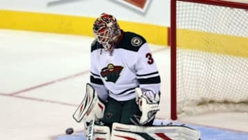 Sep 22, 2014; Winnipeg, Manitoba, CAN; Minnesota Wild goalie Ilya Bryzgalov (30) warms up as he replaces Minnesota Wild goalie Niklas Backstrom (not shown) during the second period against the Winnipeg Jets at the MTS Centre. Mandatory Credit: Bruce Fedyck-USA TODAY Sports