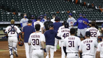 HOUSTON, TEXAS - JULY 28: The benches emptied between the Los Angeles Dodgers and Houston Astros in the sixth inning after Joe Kelly #17 of the Los Angeles Dodgers threw several high inside pitches to Carlos Correa #1 of the Houston Astros, Alex Bregman #2 and Yuli Gurriel #10 at Minute Maid Park on July 28, 2020 in Houston, Texas. (Photo by Bob Levey/Getty Images)