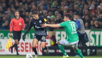 BREMEN, GERMANY - NOVEMBER 23: Milos Veljkovic of SV Werder Bremen and Amine Harit of FC Schalke 04battle for the ball during the Bundesliga match between SV Werder Bremen and FC Schalke 04 at Wohninvest Weserstadion on November 23, 2019 in Bremen, Germany. (Photo by TF-Images/Getty Images)