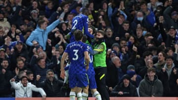 Chelsea's US midfielder Christian Pulisic is mobbed by teammates after scoring the team's second goal during the English Premier League football match between Chelsea and Liverpool at Stamford Bridge in London on January 2, 2022. - RESTRICTED TO EDITORIAL USE. No use with unauthorized audio, video, data, fixture lists, club/league logos or 'live' services. Online in-match use limited to 120 images. An additional 40 images may be used in extra time. No video emulation. Social media in-match use limited to 120 images. An additional 40 images may be used in extra time. No use in betting publications, games or single club/league/player publications. (Photo by Adrian DENNIS / AFP) / RESTRICTED TO EDITORIAL USE. No use with unauthorized audio, video, data, fixture lists, club/league logos or 'live' services. Online in-match use limited to 120 images. An additional 40 images may be used in extra time. No video emulation. Social media in-match use limited to 120 images. An additional 40 images may be used in extra time. No use in betting publications, games or single club/league/player publications. / RESTRICTED TO EDITORIAL USE. No use with unauthorized audio, video, data, fixture lists, club/league logos or 'live' services. Online in-match use limited to 120 images. An additional 40 images may be used in extra time. No video emulation. Social media in-match use limited to 120 images. An additional 40 images may be used in extra time. No use in betting publications, games or single club/league/player publications. (Photo by ADRIAN DENNIS/AFP via Getty Images)