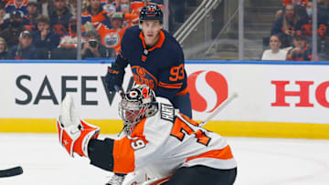 Oct 27, 2021; Edmonton, Alberta, CAN; Philadelphia Flyers goaltender Carter Hart (79) makes a glove save in front of Edmonton Oilers forward Ryan Nugent-Hopkins (93) during the first period at Rogers Place. Mandatory Credit: Perry Nelson-USA TODAY Sports