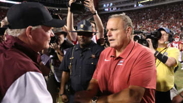 Sep 17, 2022; Fayetteville, Arkansas, USA; Missouri State Bears head coach Bobby Petrino and Arkansas Razorbacks head coach Sam Pittman meet at center field after a game at Donald W. Reynolds Razorback Stadium. Arkansas won 38-27. Mandatory Credit: Nelson Chenault-USA TODAY Sports