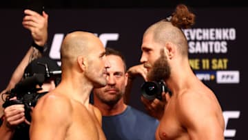 SINGAPORE, SINGAPORE - JUNE 10: UFC light heavyweight champion Glover Texeira (L) of Brazil and Jiri Prochazka of the Czech Republic face off ahead of their title bout during the UFC 275 Weigh-in at Singapore Indoor Stadium on June 10, 2022 in Singapore. (Photo by Yong Teck Lim/Getty Images)