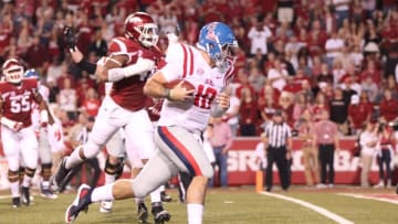 Oct 15, 2016; Fayetteville, AR, USA; Ole Miss Rebels quarterback Chad Kelly (10) rushes for a touchdown in the second quarter against the Arkansas Razorbacks at Donald W. Reynolds Razorback Stadium. Mandatory Credit: Nelson Chenault-USA TODAY Sports
