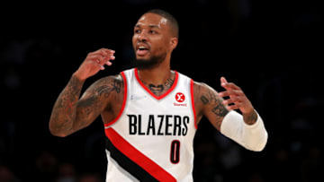 LOS ANGELES, CALIFORNIA - DECEMBER 31: Damian Lillard #0 of the Portland Trail Blazers reacts to a play during the first quarter against the Los Angeles Lakers at Crypto.com Arena on December 31, 2021 in Los Angeles, California. NOTE TO USER: User expressly acknowledges and agrees that, by downloading and or using this photograph, User is consenting to the terms and conditions of the Getty Images License Agreement. (Photo by Katelyn Mulcahy/Getty Images)