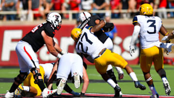 LUBBOCK, TX - OCTOBER 15: Sean Walters #27 of the West Virginia Mountaineers sacks Patrick Mahomes II #5 of the Texas Tech Red Raiders during the game on October 15, 2016 at AT&T Jones Stadium in Lubbock, Texas. (Photo by John Weast/Getty Images)