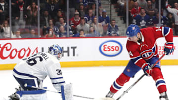 Feb 8, 2020; Montreal, Quebec, CAN; Toronto Maple Leafs goaltender Jack Campbell (36) makes a save against Montreal Canadiens center Nick Suzuki (14) during an overtime period at Bell Centre. Mandatory Credit: Jean-Yves Ahern-USA TODAY Sports