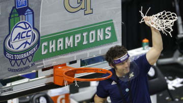 GREENSBORO, NORTH CAROLINA - MARCH 13: Head coach Josh Pastner of the Georgia Tech Yellow Jackets cuts the net from the rim after defeating the Florida State Seminoles in the ACC Men's Basketball Tournament championship game at Greensboro Coliseum on March 13, 2021 in Greensboro, North Carolina. (Photo by Jared C. Tilton/Getty Images)