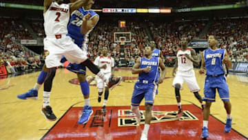 Nov 12, 2013; Louisville, KY, USA; Louisville Cardinals guard Russ Smith (2) shoots against Hofstra Pride guard/forward Jamall Robinson (20) during the second half of play at the KFC Yum! Center. Louisville defeated Hofstra 97-69. Mandatory Credit: Jamie Rhodes-USA TODAY Sports