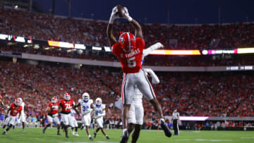 ATHENS, GEORGIA - OCTOBER 7: Rara Thomas #5 of the Georgia Bulldogs makes a touchdown reception over Maxwell Hairston #31 of the Kentucky Wildcats during the first quarter at Sanford Stadium on October 7, 2023 in Athens, Georgia. (Photo by Todd Kirkland/Getty Images)