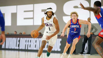 NBA G League Ignite forward Cameron Young (1) drives the ball against Motor City Cruise forward Ryan Turell Credit: Lucas Peltier-USA TODAY Sports