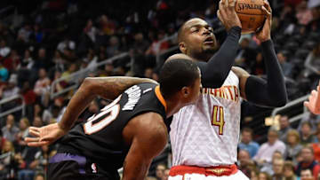 Apr 5, 2016; Atlanta, GA, USA; Atlanta Hawks forward Paul Millsap (4) controls the ball against Phoenix Suns guard Archie Goodwin (20) during the first half at Philips Arena. Mandatory Credit: Dale Zanine-USA TODAY Sports