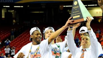 Mar 16, 2014; Atlanta, GA, USA; Florida Gators players and head coach Billy Donovan react after defeating the Kentucky Wildcats in the championship game for the SEC college basketball tournament at Georgia Dome. Florida defeated Kentucky 61-60. Mandatory Credit: Dale Zanine-USA TODAY Sports