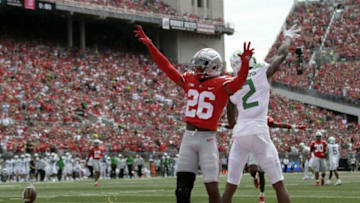 Ohio State Buckeyes cornerback Cameron Brown (26) celebrates as Oregon Ducks wide receiver Devon Williams (2) looks for a call after Brown defended Williams on a play in the endzone during Saturday's NCAA Division I football game on September 11, 2021 at Ohio Stadium in Columbus.Osu21ore Bjp 18