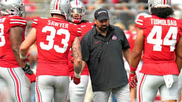 Sep 09, 2023; Columbus, OH, USA; Ohio State Head Coach Ryan Day shakes hands with Ohio State Buckeyes defensive end Jack Sawyer (33) and Ohio State Buckeyes defensive end JT Tuimoloau (44) as he watches the team during warmups before their game against Youngstown State at Ohio Stadium.