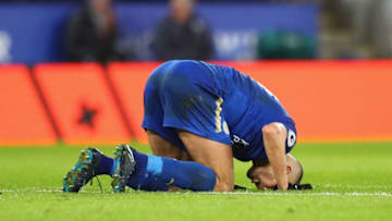 LEICESTER, ENGLAND - JANUARY 01: Islam Slimani of Leicester City falls to his knees as he celebrates scoring his team's second goal during the Premier League match between Leicester City and Huddersfield Town at The King Power Stadium on January 1, 2018 in Leicester, England. (Photo by Clive Mason/Getty Images)