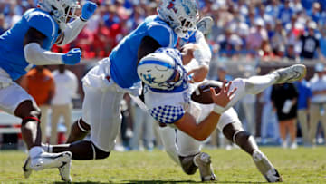 Auburn footballOct 1, 2022; Oxford, Mississippi, USA; Mississippi Rebels linebacker Troy Brown (8), linebacker Austin Keys (11) and defensive back AJ Finley (21) force the fumble by Kentucky Wildcats quarterback Will Levis (7) during the fourth quarter at Vaught-Hemingway Stadium. Mandatory Credit: Petre Thomas-USA TODAY Sports