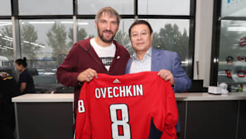 BEIJING, CHINA - AUGUST 04: Alex Ovechkin poses with Zhou Yunjie, the Chairman of ORG Technology Co., Ltd at AZ Rink on August 04, 2019 in Beijing, China. (Photo by Emmanuel Wong/NHLI via Getty Images)