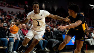 Cincinnati Bearcats guard Landers Nolley II drives against the East Carolina Pirates at Fifth Third Arena. The Enquirer.
