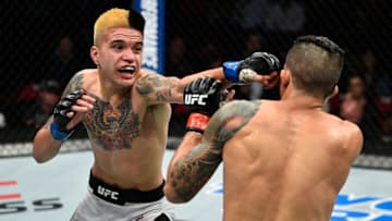 FRESNO, CA - DECEMBER 09: (L-R) Benito Lopez punches Albert Morales in their bantamweight bout during the UFC Fight Night event inside Save Mart Center on December 9, 2017 in Fresno, California. (Photo by Jeff Bottari/Zuffa LLC/Zuffa LLC via Getty Images)