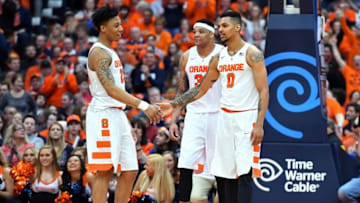 Feb 27, 2016; Syracuse, NY, USA; Syracuse Orange guard Malachi Richardson (23) greets forward Michael Gbinije (0) during a stop in play against the North Carolina State Wolfpack during the second half at the Carrier Dome. Syracuse defeated North Carolina State 75-66. Mandatory Credit: Rich Barnes-USA TODAY Sports