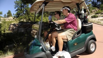 SEDALIA, CO--AUGUST 26TH 2010--Former Colorado Avalanche superstar, Joe Sakic, right, drives the golf-cart down a path with fellow golfer, John Bukowski, after hitting off of the #1 tee box to start the 13th Annual Joe Sakic Celebrity Classic golf tournament at the Sanctuary golf course in Sedalia Colorado, Thursday August 26th 2010. Sakic hosted fellow avalanche players and celebrities in the tournament, sponsored by RE/MAX and benefitting Food Bank of the Rockies' Children's programs. "Food Bank of the Rockies, is a non-profit organization, that has distributed nearly 36 million pounds of food last year through 800 partner agencies." "Since 1978, FBR has provided 392 million pounds of food to member agencies , which translates into more than 298 million meals for people in need." Andy Cross, The Denver Post (Photo By Andy Cross/The Denver Post via Getty Images)