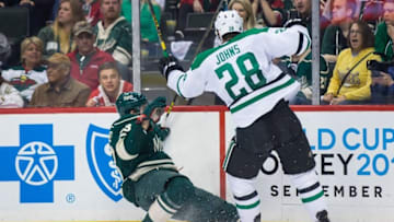Apr 20, 2016; Saint Paul, MN, USA; Dallas Stars defenseman Stephen Johns (28) checks Minnesota Wild forward Kurtis Gabriel (63) in the first period in game four of the first round of the 2016 Stanley Cup Playoffs at Xcel Energy Center. Mandatory Credit: Brad Rempel-USA TODAY Sports