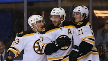 Feb 4, 2015; New York, NY, USA; Boston Bruins center Patrice Bergeron (37) celebrates wing Brad Marchand (63) and left wing Loui Eriksson (21) after scoring a goal against the New York Rangers during the first period at Madison Square Garden. Mandatory Credit: Adam Hunger-USA TODAY Sports