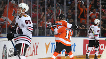 PRAGUE, CZECH REPUBLIC - OCTOBER 04: Oskar Lindblom #23 and Travis Konecny #11 of the Philadelphia Flyers celebrate after Lindblom scored against the Chicago Blackhawks in the second period during the NHL Global Series Challenge 2019 match at O2 Arena on October 4, 2019 in Prague, Czech Republic. (Photo by Chase Agnello-Dean/NHLI via Getty Images)
