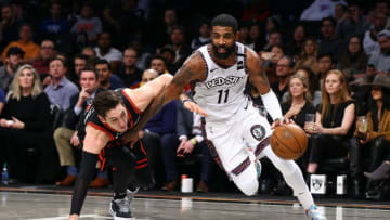 NEW YORK, NEW YORK - JANUARY 31: Kyrie Irving #11 of the Brooklyn Nets in action against Ryan Arcidiacono #51 of the Chicago Bulls at Barclays Center on January 31, 2020 in New York City. NOTE TO USER: User expressly acknowledges and agrees that, by downloading and or using this photograph, User is consenting to the terms and conditions of the Getty Images License Agreement. Brooklyn Nets defeated the Chicago Bulls 133-118. (Photo by Mike Stobe/Getty Images)