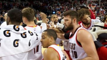 Mar 30, 2015; Portland, OR, USA; Portland Trail Blazers huddle at half court and celebrate 109-86 win over Phoenix Suns at Moda Center at the Rose Quarter. Mandatory Credit: Jaime Valdez-USA TODAY Sports