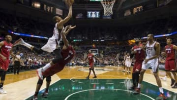 Mar 29, 2014; Milwaukee, WI, USA; Milwaukee Bucks guard Giannis Antetokounmpo (34) runs into Miami Heat center Chris Bosh (1) during the second quarter at BMO Harris Bradley Center. Mandatory Credit: Jeff Hanisch-USA TODAY Sports