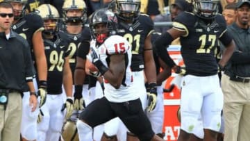 Sep 28, 2013; West Lafayette, IN, USA; Northern Illinois Huskies safety Jimmie Ward (15) returns an interception for a touchdown against the Purdue Boilermakers at Ross Ade Stadium. Northern Illinois won 55-24. Mandatory Credit: Pat Lovell-USA TODAY Sports