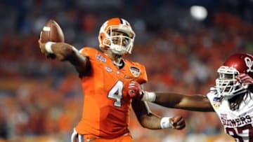 Dec 31, 2015; Miami Gardens, FL, USA; Clemson Tigers quarterback Deshaun Watson (4) throws against Oklahoma Sooners defensive end D.J. Ward (87) during the second quarter of the 2015 CFP semifinal at the Orange Bowl at Sun Life Stadium. Mandatory Credit: Robert Duyos-USA TODAY Sports